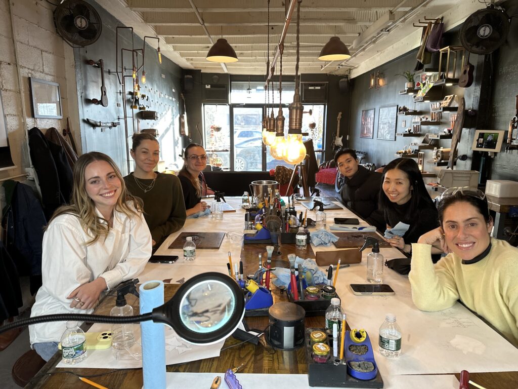 people smiling during a group workshop at craftsman ave