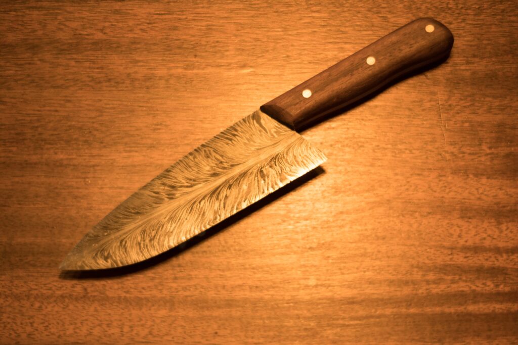 handmade custom metal knife with wooden handle
