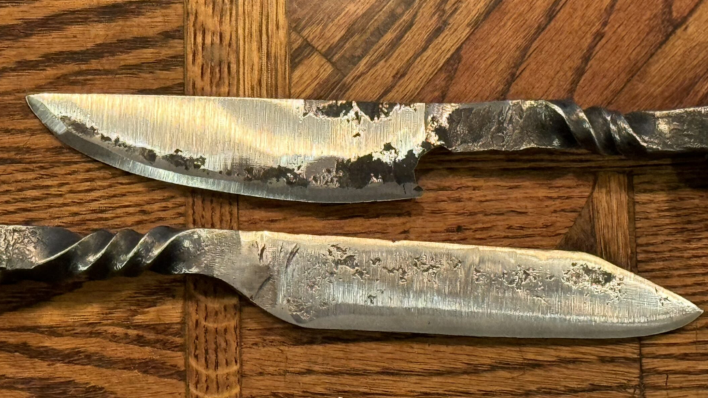 knife blades against a wooden background